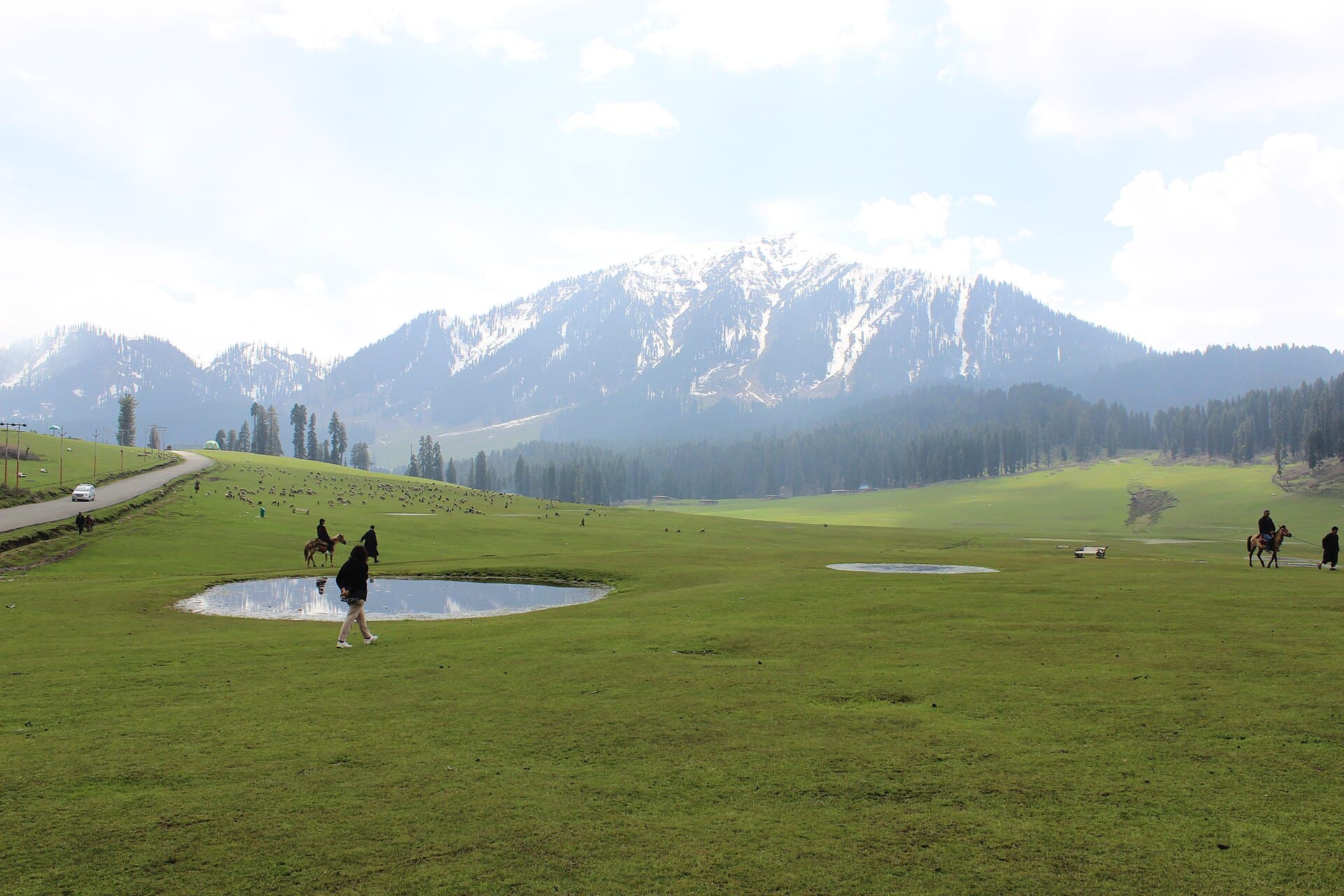 Green meadows and snow-capped Pir Panjal peaks at Doodhpathri